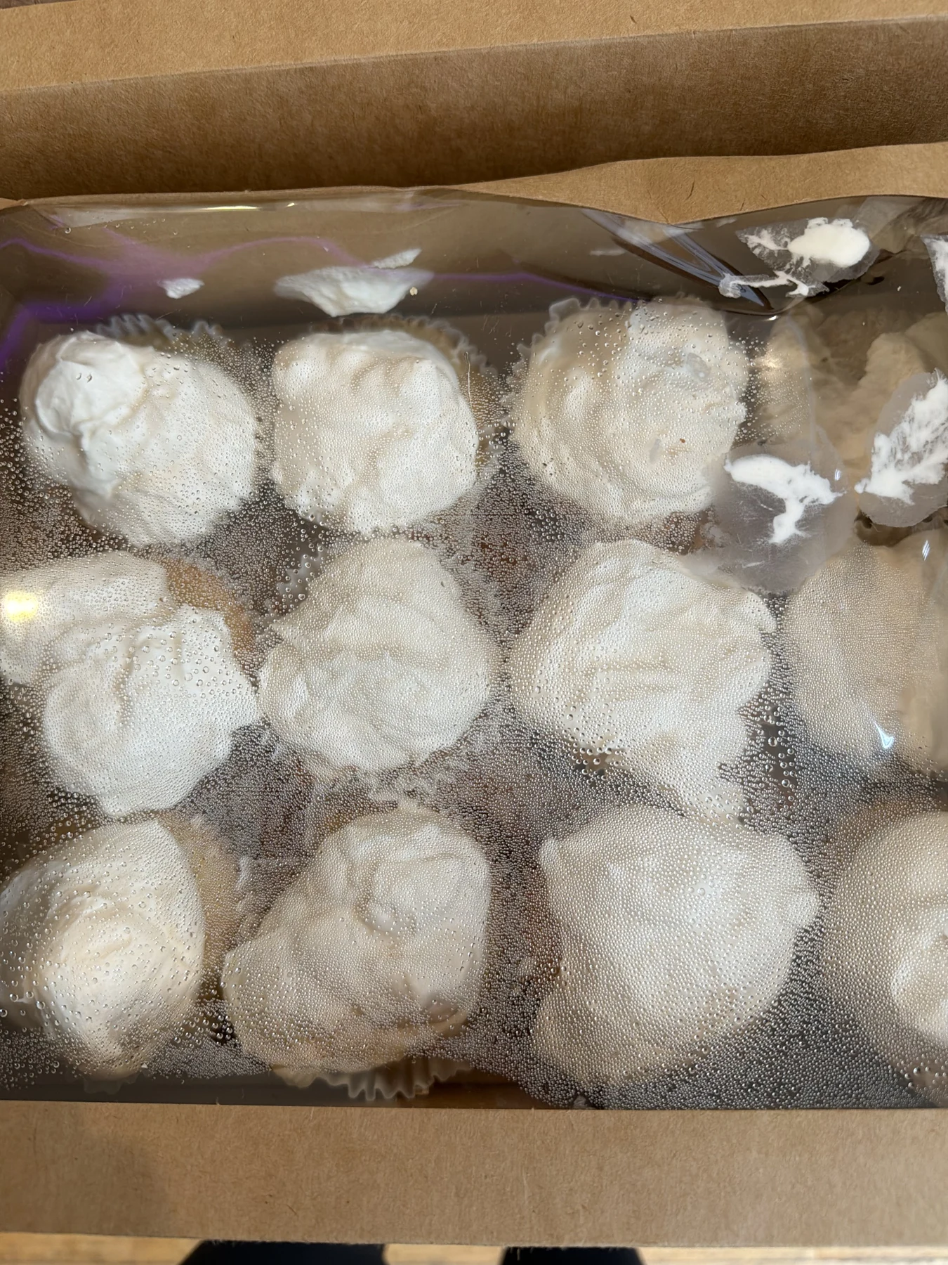 Frosted cupcakes packed in a box