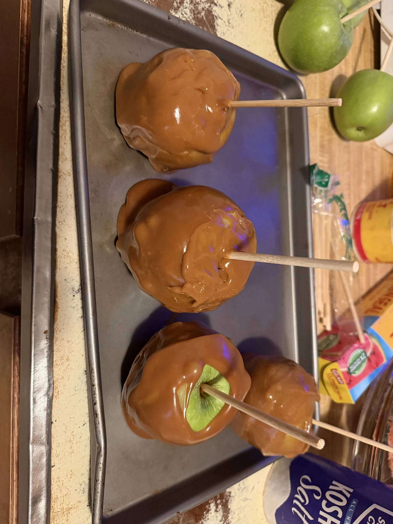 Caramel-coated treats on sticks