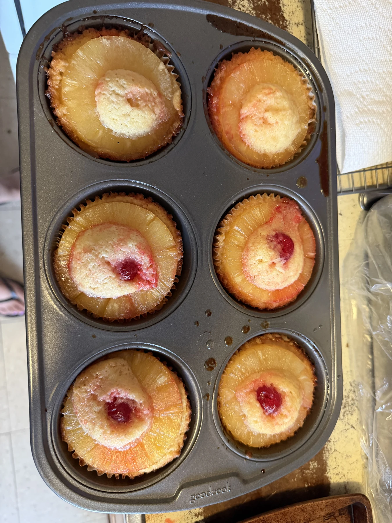 Individual pineapple-style cakes in a baking tray
